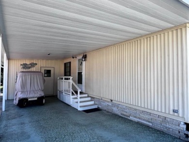 Discover easy Florida living in this 2-bedroom, 2-bath home on Lake Henry Golf Club in Florida - for sale on GolfHomes.com, golf home, golf lot