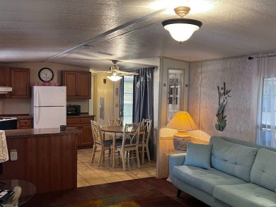 Discover easy Florida living in this 2-bedroom, 2-bath home on Lake Henry Golf Club in Florida - for sale on GolfHomes.com, golf home, golf lot