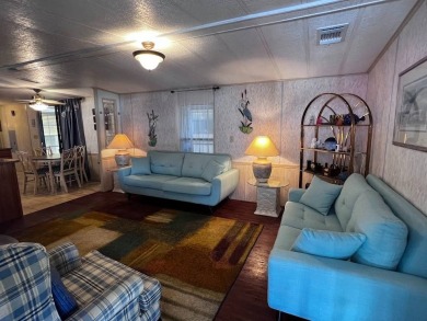 Discover easy Florida living in this 2-bedroom, 2-bath home on Lake Henry Golf Club in Florida - for sale on GolfHomes.com, golf home, golf lot