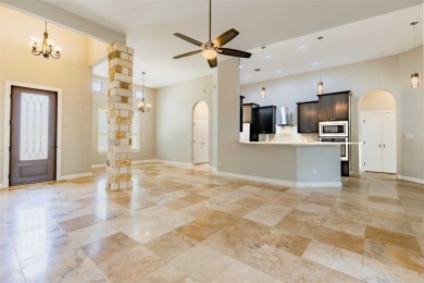 This spacious single-story home features a 2-car garage and a on Lago Vista Golf Club in Texas - for sale on GolfHomes.com, golf home, golf lot