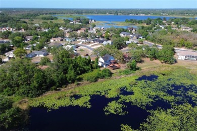 Across the street from a golf course, just off Hunter's Lake on Oak Hills Country Club in Florida - for sale on GolfHomes.com, golf home, golf lot
