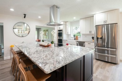 MOVE IN READY - NEWLY DESIGNED  3 BEDROOM/3 BATH POOL HOME ON on Yacht and Country Club in Florida - for sale on GolfHomes.com, golf home, golf lot