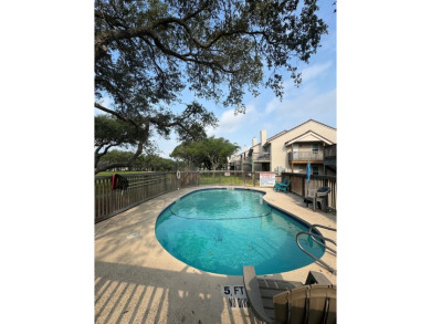Highly sought after ground floor corner end unit overlooking the on Rockport Country Club in Texas - for sale on GolfHomes.com, golf home, golf lot