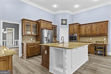 Discover elegance and comfort in this stunning home nestled in on Traditions of Braselton Golf Club in Georgia - for sale on GolfHomes.com, golf home, golf lot