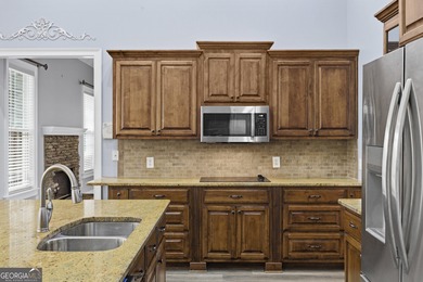 Discover elegance and comfort in this stunning home nestled in on Traditions of Braselton Golf Club in Georgia - for sale on GolfHomes.com, golf home, golf lot