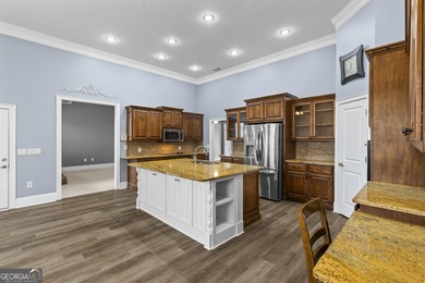 Discover elegance and comfort in this stunning home nestled in on Traditions of Braselton Golf Club in Georgia - for sale on GolfHomes.com, golf home, golf lot