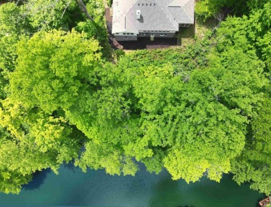 Experience refined lakefront living in this meticulously crafted on Foxcliff Golf Club in Indiana - for sale on GolfHomes.com, golf home, golf lot