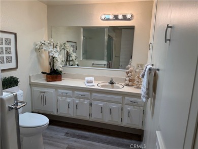 This delightful 2 bedroom 1 bathroom home features a spacious on Leisure World Seal Beach Golf Course in California - for sale on GolfHomes.com, golf home, golf lot