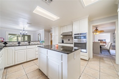 Welcome to this exceptional 4,667-square-foot residence located on Corpus Christi Country Club Golf Course in Texas - for sale on GolfHomes.com, golf home, golf lot