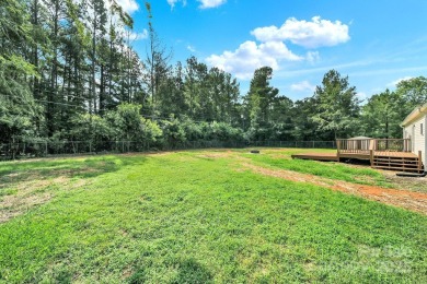 Welcome to this stunning 3-bedroom, 2-bathroom home nestled on on Rock Hill Country Club in South Carolina - for sale on GolfHomes.com, golf home, golf lot