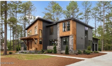 Nestled on a quiet culdesac, this contemporary home constructed on Forest Creek Golf Club  in North Carolina - for sale on GolfHomes.com, golf home, golf lot