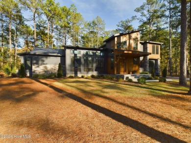 Nestled on a quiet culdesac, this contemporary home constructed on Forest Creek Golf Club  in North Carolina - for sale on GolfHomes.com, golf home, golf lot