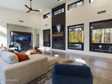 Nestled on a quiet culdesac, this contemporary home constructed on Forest Creek Golf Club  in North Carolina - for sale on GolfHomes.com, golf home, golf lot