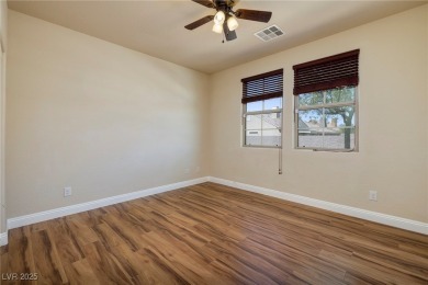 Single story home 2BR+den with wood laminate floors throughout on Tuscany Golf Club in Nevada - for sale on GolfHomes.com, golf home, golf lot