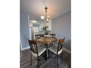 Beautifully upgraded 1 bedroom 1 bath  condo with shaker on Sunrise Lakes Phase III in Florida - for sale on GolfHomes.com, golf home, golf lot