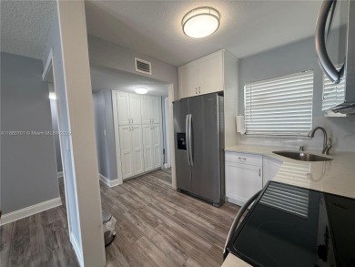 Beautifully upgraded 1 bedroom 1 bath  condo with shaker on Sunrise Lakes Phase III in Florida - for sale on GolfHomes.com, golf home, golf lot