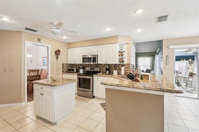 Experience the pinnacle of golf course living in this on Caloosa Greens Executive Golf Course in Florida - for sale on GolfHomes.com, golf home, golf lot