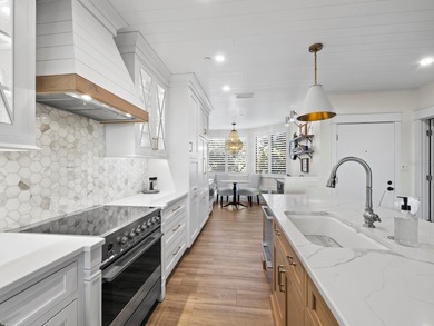 Welcome to a masterfully reimagined two-bedroom, 2.5-bath on Longboat Key Golf Club Resort in Florida - for sale on GolfHomes.com, golf home, golf lot