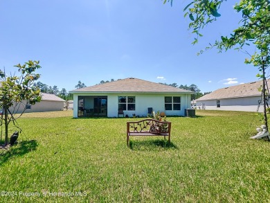 Beautifully maintained 4 bedroom, 2 bathroom home in the gated on Hernando Oaks Golf and Country Club in Florida - for sale on GolfHomes.com, golf home, golf lot