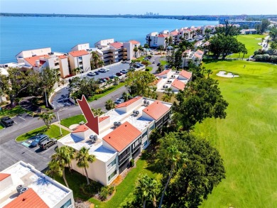 GORGEOUS & nestled on the golf greens with peaceful views, this on Isla Del Sol Yacht and Country Club in Florida - for sale on GolfHomes.com, golf home, golf lot
