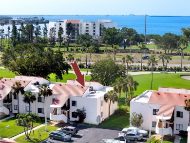 GORGEOUS & nestled on the golf greens with peaceful views, this on Isla Del Sol Yacht and Country Club in Florida - for sale on GolfHomes.com, golf home, golf lot