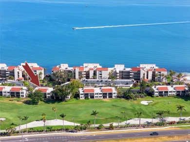 GORGEOUS & nestled on the golf greens with peaceful views, this on Isla Del Sol Yacht and Country Club in Florida - for sale on GolfHomes.com, golf home, golf lot