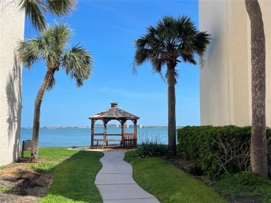 GORGEOUS & nestled on the golf greens with peaceful views, this on Isla Del Sol Yacht and Country Club in Florida - for sale on GolfHomes.com, golf home, golf lot