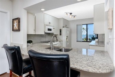 GORGEOUS & nestled on the golf greens with peaceful views, this on Isla Del Sol Yacht and Country Club in Florida - for sale on GolfHomes.com, golf home, golf lot