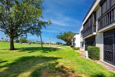 GORGEOUS & nestled on the golf greens with peaceful views, this on Isla Del Sol Yacht and Country Club in Florida - for sale on GolfHomes.com, golf home, golf lot