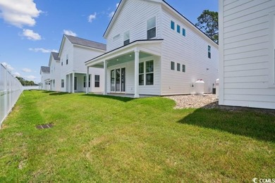 Fall in love with this 3-bedroom, 2.5-bath home with a spacious on Tidewater Golf Club and Plantation in South Carolina - for sale on GolfHomes.com, golf home, golf lot