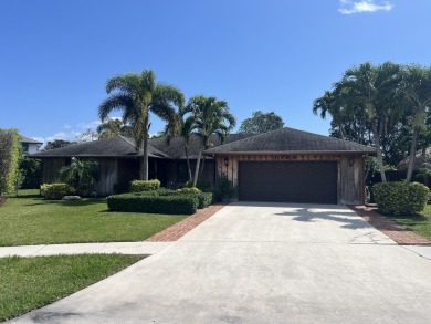 New roof coming soon.This beautiful CBS home  with cedar wood on West Palm Beach Golf Course in Florida - for sale on GolfHomes.com, golf home, golf lot
