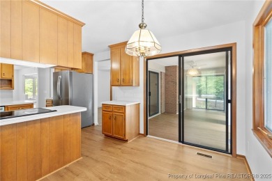 Welcome to a beautifully, partially updated brick home nestled on Carolina Trace Country Club in North Carolina - for sale on GolfHomes.com, golf home, golf lot
