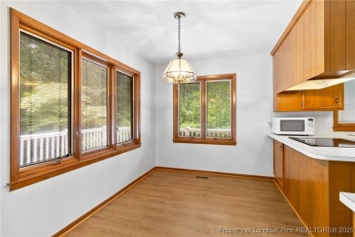 Welcome to a beautifully, partially updated brick home nestled on Carolina Trace Country Club in North Carolina - for sale on GolfHomes.com, golf home, golf lot
