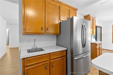 Welcome to a beautifully, partially updated brick home nestled on Carolina Trace Country Club in North Carolina - for sale on GolfHomes.com, golf home, golf lot