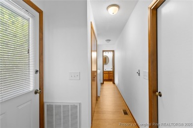 Welcome to a beautifully, partially updated brick home nestled on Carolina Trace Country Club in North Carolina - for sale on GolfHomes.com, golf home, golf lot