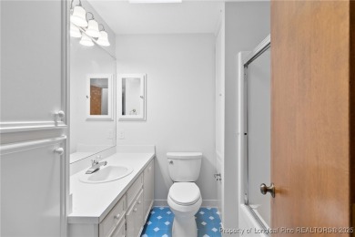 Welcome to a beautifully, partially updated brick home nestled on Carolina Trace Country Club in North Carolina - for sale on GolfHomes.com, golf home, golf lot
