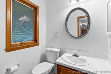Welcome to a beautifully, partially updated brick home nestled on Carolina Trace Country Club in North Carolina - for sale on GolfHomes.com, golf home, golf lot