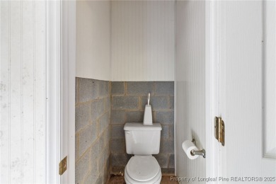 Welcome to a beautifully, partially updated brick home nestled on Carolina Trace Country Club in North Carolina - for sale on GolfHomes.com, golf home, golf lot