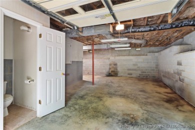 Welcome to a beautifully, partially updated brick home nestled on Carolina Trace Country Club in North Carolina - for sale on GolfHomes.com, golf home, golf lot