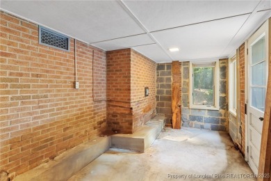 Welcome to a beautifully, partially updated brick home nestled on Carolina Trace Country Club in North Carolina - for sale on GolfHomes.com, golf home, golf lot