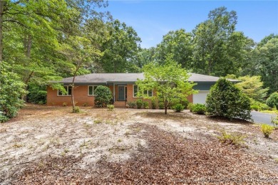 Welcome to a beautifully, partially updated brick home nestled on Carolina Trace Country Club in North Carolina - for sale on GolfHomes.com, golf home, golf lot