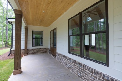 The Reagan plan built by Tradecraft Homes. Stunning new on Harbor Club Golf and Country Club in Georgia - for sale on GolfHomes.com, golf home, golf lot