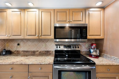 This beautifully maintained Mediterranean Carriage home on Palm Aire Country Club of Sarasota in Florida - for sale on GolfHomes.com, golf home, golf lot