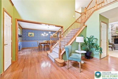 Perched atop a scenic hilltop, 136 Outlook Court offers a unique on Country Club of the Poconos Golf Course in Pennsylvania - for sale on GolfHomes.com, golf home, golf lot