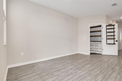 This tastefully done resort style townhome in a gated community on Gulf Harbors Golf Course in Florida - for sale on GolfHomes.com, golf home, golf lot