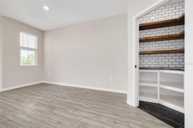 This tastefully done resort style townhome in a gated community on Gulf Harbors Golf Course in Florida - for sale on GolfHomes.com, golf home, golf lot