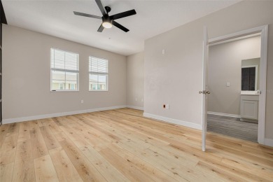 This tastefully done resort style townhome in a gated community on Gulf Harbors Golf Course in Florida - for sale on GolfHomes.com, golf home, golf lot
