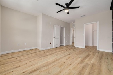 This tastefully done resort style townhome in a gated community on Gulf Harbors Golf Course in Florida - for sale on GolfHomes.com, golf home, golf lot