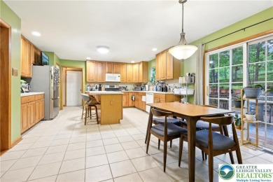 Perched atop a scenic hilltop, 136 Outlook Court offers a unique on Country Club of the Poconos Golf Course in Pennsylvania - for sale on GolfHomes.com, golf home, golf lot