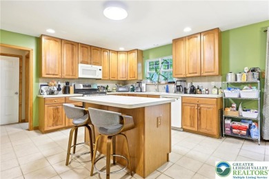 Perched atop a scenic hilltop, 136 Outlook Court offers a unique on Country Club of the Poconos Golf Course in Pennsylvania - for sale on GolfHomes.com, golf home, golf lot